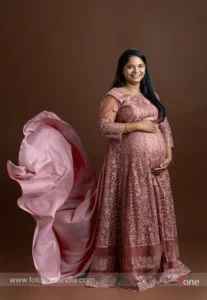 Pregnancy photoshoot with artistic studio lighting
